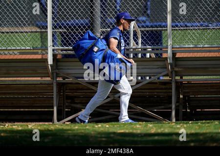 Los Angeles Dodgers catcher Austin Barnes runs with all his catcher's gear  to a practice field during a spring training baseball practice Tuesday,  Feb. 23, 2021, in Phoenix. (AP Photo/Ross D. Franklin