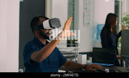 Database admin working with virtual reality glasses to develop server app in it agency office, using source code. Checking programming language on cloud computing database, web developer. Stock Photo