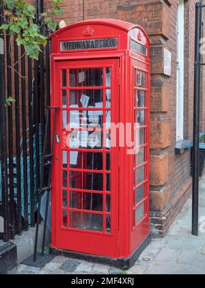An old fashioned telephone box converted into the Medway Art Box in the centre of historic Rochester, Kent, UK. Stock Photo