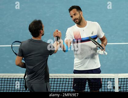 Italy s Salvatore Caruso right greets compatriot Fabio Fognini