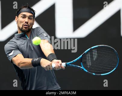 Italy s Fabio Fognini makes a backhand return to compatriot