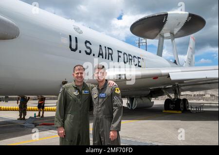 U.S. Air Force Col. Dominic Setka, former 5th Air Force chief of staff, left, and U.S Air Force Capt. Nathan Setka, 961st Airborne Air Control Squadron air weapons officer, pose for a photo in front of an E-3 Sentry at Kadena Air Base, Japan, Aug. 17, 2022. Dominic will be retiring from the Air Force at the end of this year. Stock Photo