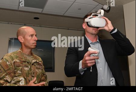Col. Matthew Calhoun, 131st Bomb Wing commander, waits to use a virtual reality headset at Whiteman Air Force Base, Missouri, August 17, 2022. The headsets dispalyed 3D images of the upcoming changes to the flightline that will accomodate the arrival of the B-21 Raider. AIR FORCE,B-2 Spirit,B-21 Raider,Bomb Wing,Virtual Reality,aircraft, Stock Photo