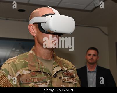 Col. Matthew Calhoun, 131st Bomb Wing commander, uses a virtual reality headset at Whiteman Air Force Base, Missouri, August 17, 2022. The headsets dispalyed 3D images of the upcoming flightline changes to accomodate the upcoming B-21 Raider. AIR FORCE,B-2 Spirit,B-21 Raider,Bomb Wing,Virtual Reality,aircraft, Stock Photo
