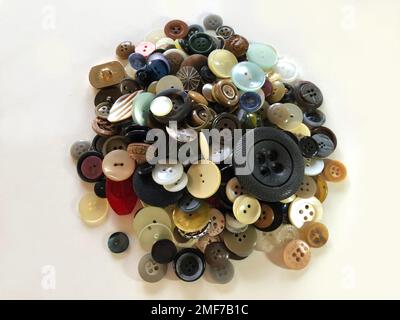 Heap of vintage buttons on a white background Stock Photo