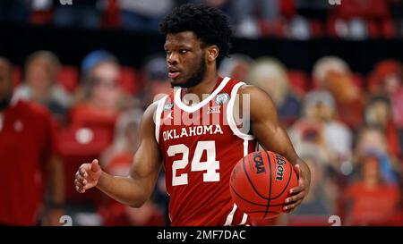 Oklahoma's Elijah Harkless (24) dribbles during the first half of a