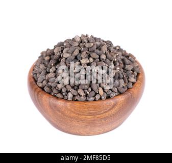 Borage seeds in wooden bowl, isolated on a white background. Borago officinalis seeds Stock Photo