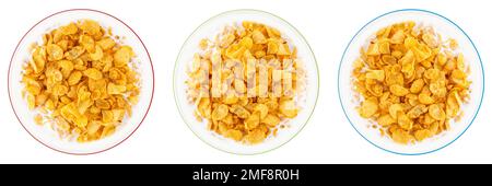 Bowl of sweet cornflakes with milk isolated on white background, top view Stock Photo