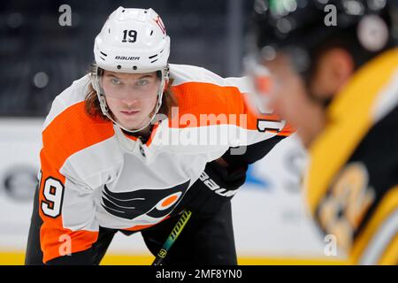 Philadelphia Flyers' Nolan Patrick (19) fights for control of the puck with  New Jersey Devils' Jack Hughes (86) during the third period of an NHL hockey  game Tuesday, Jan. 26, 2021, in