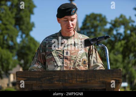 U.S. Army Command Sgt. Maj Christopher A. Simpson, incoming senior enlisted advisor, 79th Explosive Ordnance Disposal Battalion, 71st Ordinance Group, 20th CBRNE Command, speaks to his unit during a Change of Responsibility ceremony at the Cavalry Parade Field, Fort Riley, Kansas, August 18th, 2022. Simpson said, “I am honored for this opportunity to join your team, and I look forward to the opportunity to serve each and every one of you.” Stock Photo