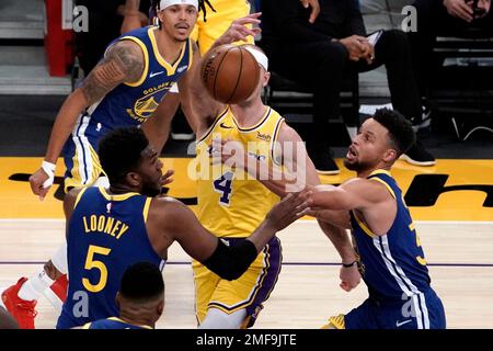 Golden State Warriors Kevon Looney left and Stephen Curry