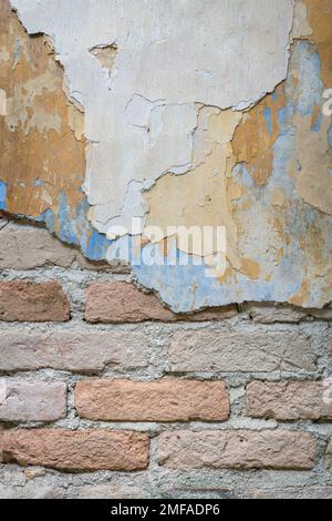 Grungy brick and peeled painted wall. Backdrop or background concept. Stock Photo