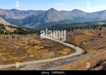 Autumn at Cottonwood Pass - Panoramic Autumn overview of a winding mountain road at east of summit of Cottonwood Pass. Buena Vista - Crested Butte, CO. Stock Photo