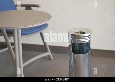 Close up burning cigarette in ashtray on table  Stock Photo