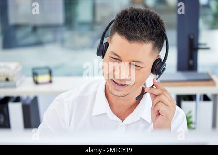 Call center, contact us and customer service worker consulting or working telemarketing in the office. CRM, help and happy male agent, consultant or Stock Photo
