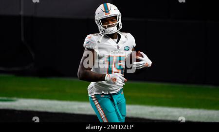 Miami Dolphins running back Lynn Bowden (15) warms up before an NFL  football game against the C …