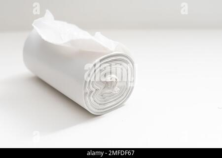 White plastic polyethylene trash bag roll isolated over the white background, set of multiple different foreshortenings. Stock Photo