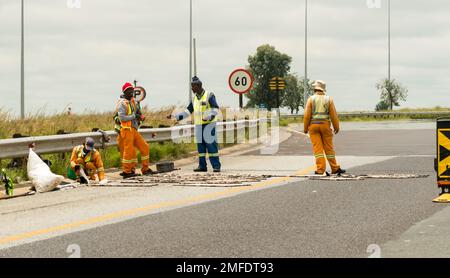 road workers, employees working on repair of infrastructure in South Africa concept people at work in Africa, employment Stock Photo