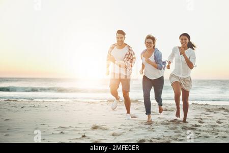 Friendship is what keeps your spirit alive. three friends enjoying themselves while spending the day outdoors. Stock Photo