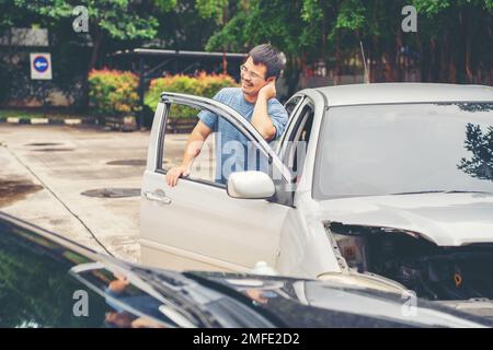 Man Upset and Sit down Motorist In Crash For Crash Insurance Fraud Getting Out Of Car Stock Photo