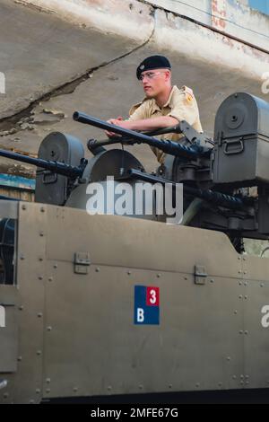 Hel, Poland - August 2022 Military troops marching during 3 May Polish Constitution Day ceremonial patriotic parade. Polish armed forces tanker military parade. Old guns and cars. Feast of Polish Armed Forces Day, American soldiers with US flag on parade Nato Vehicles Military Equipment  Stock Photo