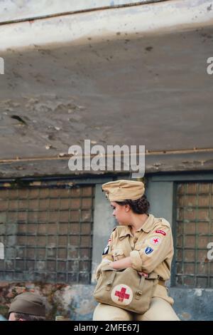 Hel, Poland - August 2022 Military troops marching during 3 May Polish Constitution Day ceremonial patriotic parade. Polish armed forces tanker military parade. Old guns and cars. Feast of Polish Armed Forces Day, American soldiers with US flag on parade Nato Vehicles Military Equipment  Stock Photo