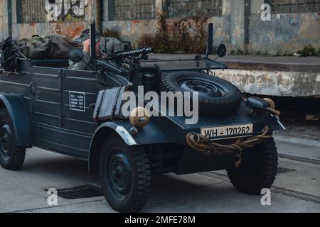 Hel, Poland - August 2022 Military troops marching during 3 May Polish Constitution Day ceremonial patriotic parade. Polish armed forces tanker military parade. Old guns and cars. Feast of Polish Armed Forces Day, American soldiers with US flag on parade Nato Vehicles Military Equipment  Stock Photo