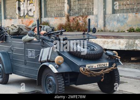 Hel, Poland - August 2022 Military troops marching during 3 May Polish Constitution Day ceremonial patriotic parade. Polish armed forces tanker military parade. Old guns and cars. Feast of Polish Armed Forces Day, American soldiers with US flag on parade Nato Vehicles Military Equipment  Stock Photo