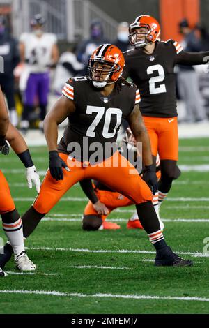 Cleveland Browns offensive tackle Kendall Lamm (70) is escorted to the  locker room after getting injured during the second half of an NFL  divisional round football game against the Kansas City Chiefs