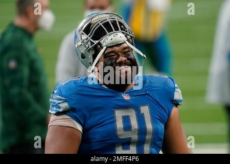 Detroit Lions defensive tackle John Penisini (98) talks with Cleveland  Browns linebacker Sione Takitaki (44) after the Browns defeated the Lions  13-10 after an NFL football game, Sunday, Nov. 21, 2021, in