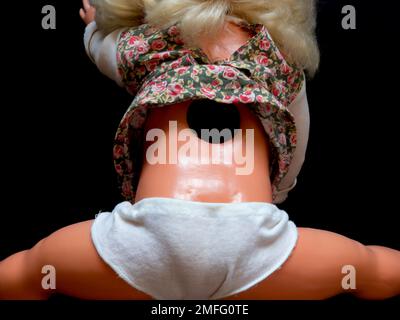 Miniature doll, made in DDR. DDR is the German acronym for Deutsche Demokratische Republik (German) or German Democratic Republic (English), a former state in Europe, 1949-1990. Stock Photo