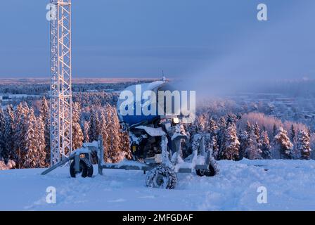 UMEA, SWEDEN ON DECEMBER 20, 2014. Snow-making, snow-gun equipment in action. View from the slope. Editorial use. Stock Photo