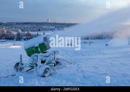UMEA, SWEDEN ON DECEMBER 20, 2014. Snow-making, snow-gun equipment in action. View from the slope. Editorial use. Stock Photo