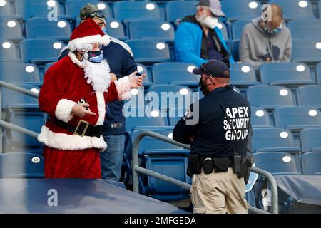 A Tennessee Titans fan is dressed as Santa as he watches the Titans play  the San Diego Chargers in the second quarter of an NFL football game on  Friday, Dec. 25, 2009