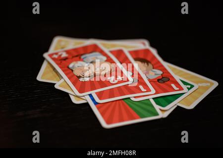 Ivano-Frankivsk, Ukraine November 20, 2022: Children play board games, playing cards with children on birthday holidays, educational games, Cards Uno. Stock Photo