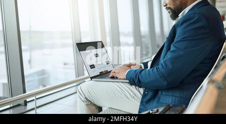 Travel, businessman and at an airport working on a laptop and waiting at terminal or boarding lounge. Entrepreneur, corporate or employee using Stock Photo