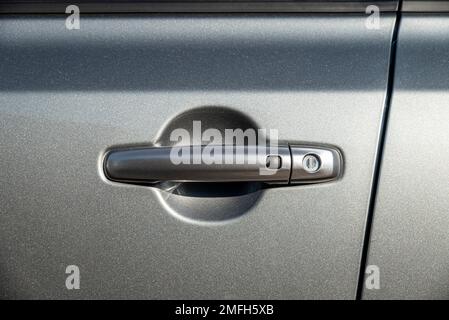 Car door handle with unlock button. keyless entry car door handle with touch sensor Stock Photo
