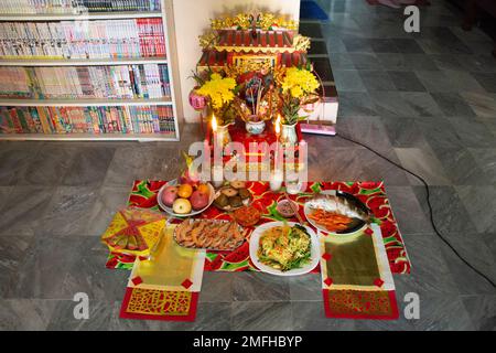 Sacrificial offering for chinese tutelary deity folk religion of taoism Tudigong or Tudishen god lord of soil and ground in shrine in new year at hous Stock Photo