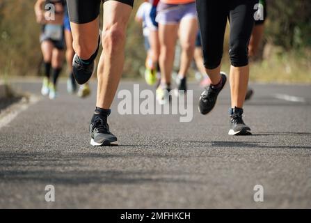 Marathon running race, people feet on city road Stock Photo - Alamy