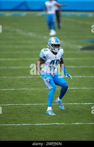 Detroit Lions safety C.J. Moore prays in the end zone before an