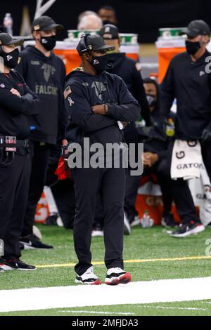 FILE - In this Dec. 27, 2020, file photo, Atlanta Falcons head coach Raheem  Morris walks on the sideline during the first half of an NFL football game  against the Kansas City