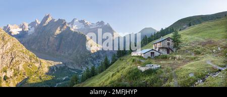 The Val Ferret valley in Italy and peaks Les Courtes, Aiguille de Triolet and Mt. Dolent - Trekking Mont Blank. Stock Photo