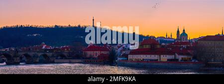 Panorama of Mala Strana district at dusk with spires of medieval churches and towers, Prague, Czechia Stock Photo