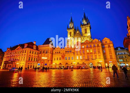 PRAGUE, CZECHIA - MARCH 11, 2022: Night walk on Old Town Square and enjoy great illumination of surrounding buildings, on March 11 in Prague, Czechia Stock Photo