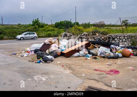 Litter is thrown to the side of the road outside of of the Late Baroque town of Syracuse. Stock Photo