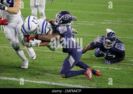 Indianapolis Colts' Nyheim Hines, left, and Jacksonville Jaguars' Will  Richardson Jr. hold autographed jerseys following an NFL football game,  Sunday, Nov. 17, 2019, in Indianapolis. Indianapolis won 33-13. (AP  Photo/Michael Conroy Stock