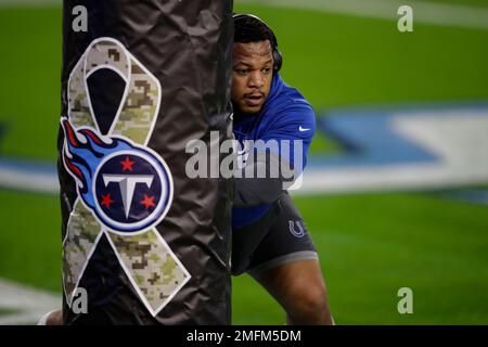 An Indianapolis Colts player warms up by a Salute to Service military  appreciation logo before an NFL football game against the Tennessee Titans  Thursday, Nov. 12, 2020, in Nashville, Tenn. (AP Photo/Ben