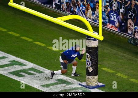 An Indianapolis Colts player warms up by a Salute to Service military  appreciation logo before an NFL football game against the Tennessee Titans  Thursday, Nov. 12, 2020, in Nashville, Tenn. (AP Photo/Ben