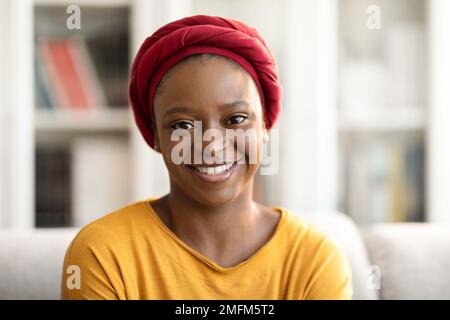 Portrait of pretty young black woman posing at home Stock Photo