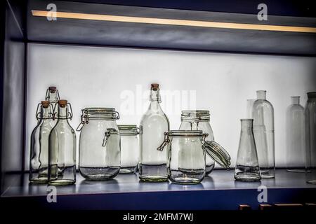 A group of glass containers, bottles and jars in a modern kitchen Stock Photo